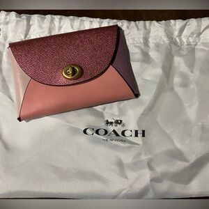 Never used, Coach (Re)Loved Medium color block pouch in pink